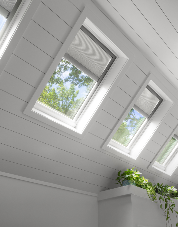 VELUX pre-installed integrated shades in Skylight System — solar-powered room-darkening shade included with every system
