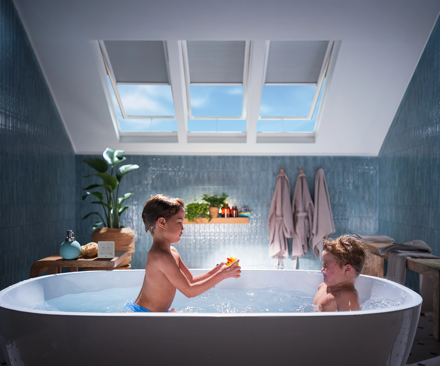 VELUX Skylight Systems installed in a sunlit dining room with natural daylight through the ceiling