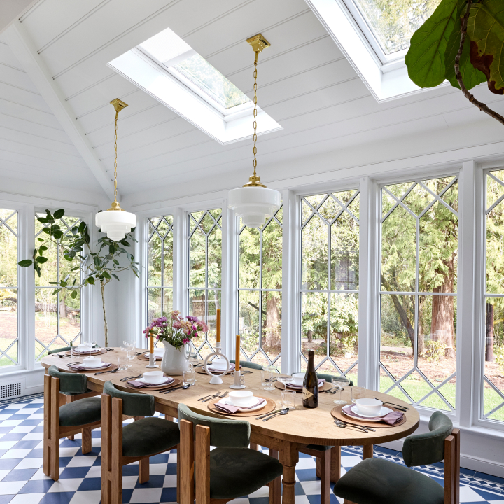 VELUX Skylight System installed in a sunlit dining room with skylights bringing natural daylight through the ceiling