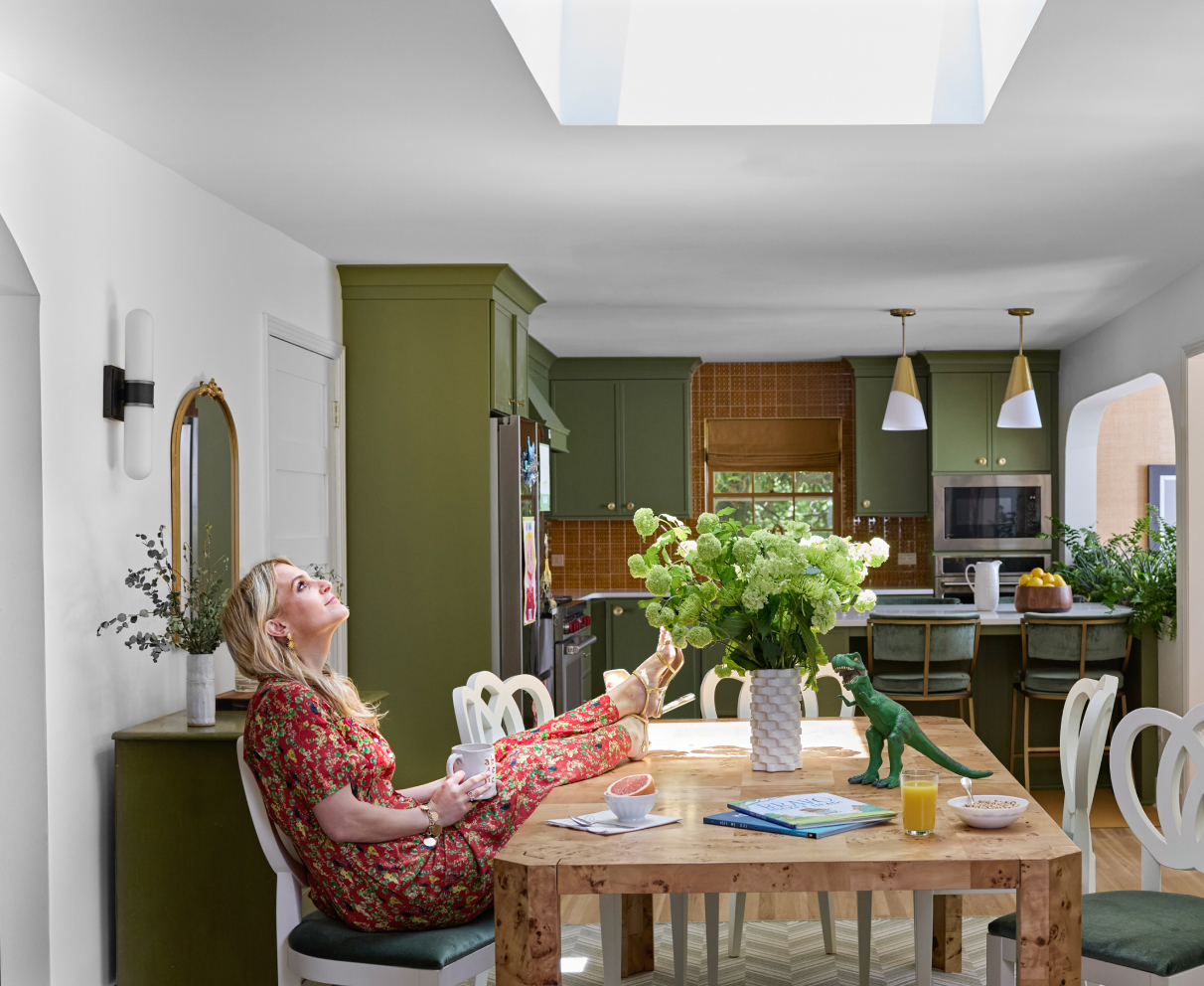 VELUX Skylight System lifestyle — homeowner enjoying natural light and fresh air in a bright home interior