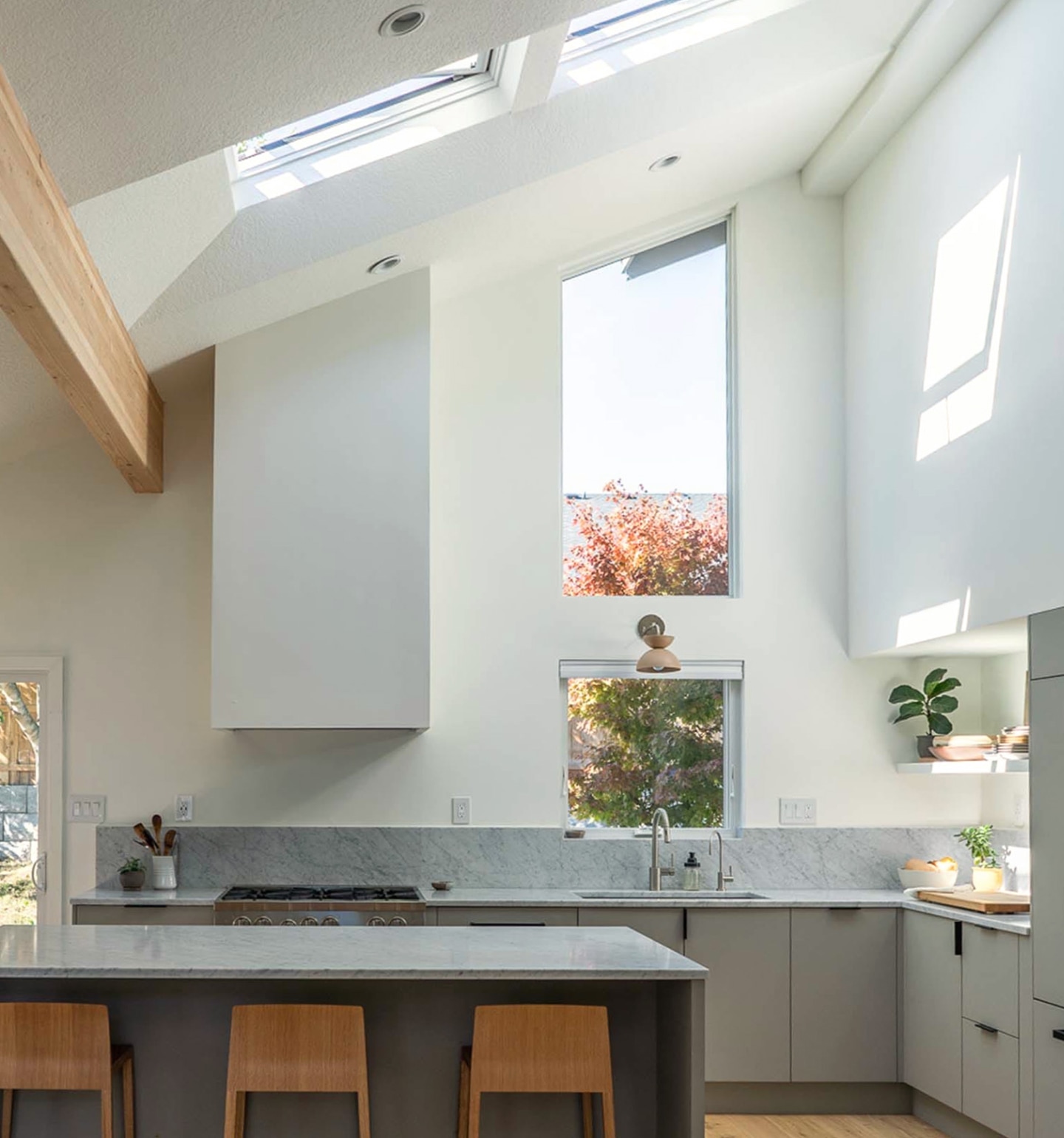 Photograph of bed placed under a skylight