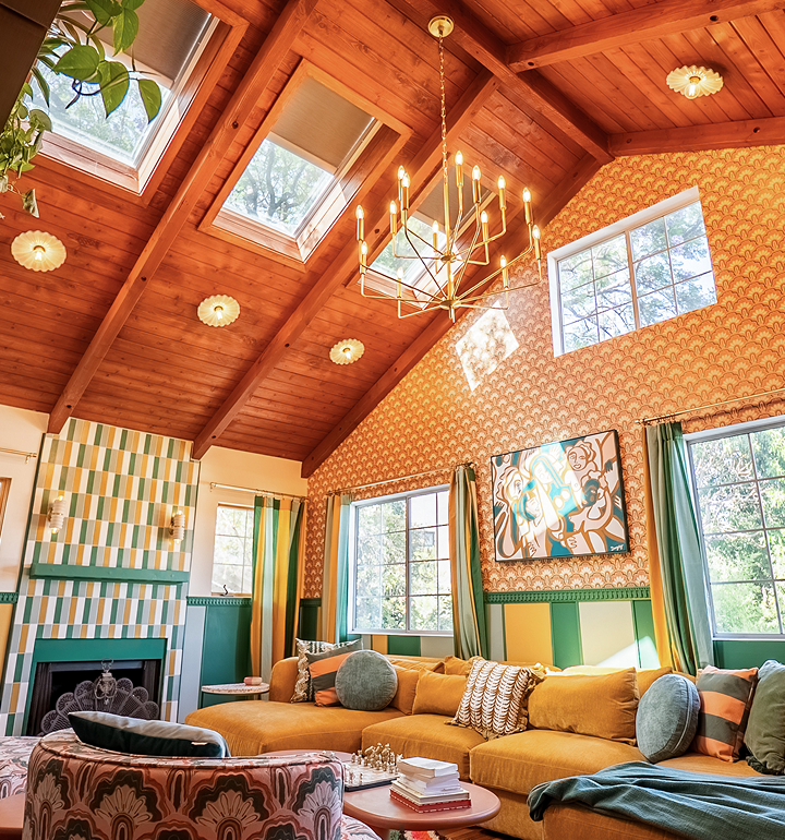 Photograph of warmly light home with skylights and chandelier