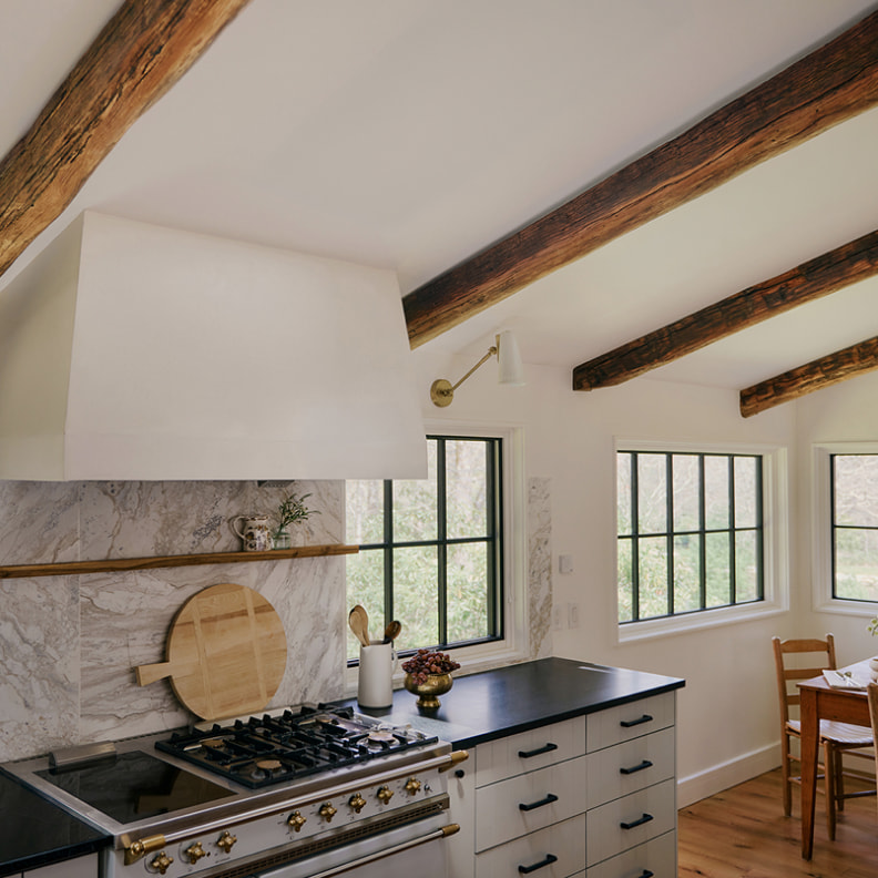 Kitchen interior before VELUX skylight installation — dark ceiling, limited natural light
