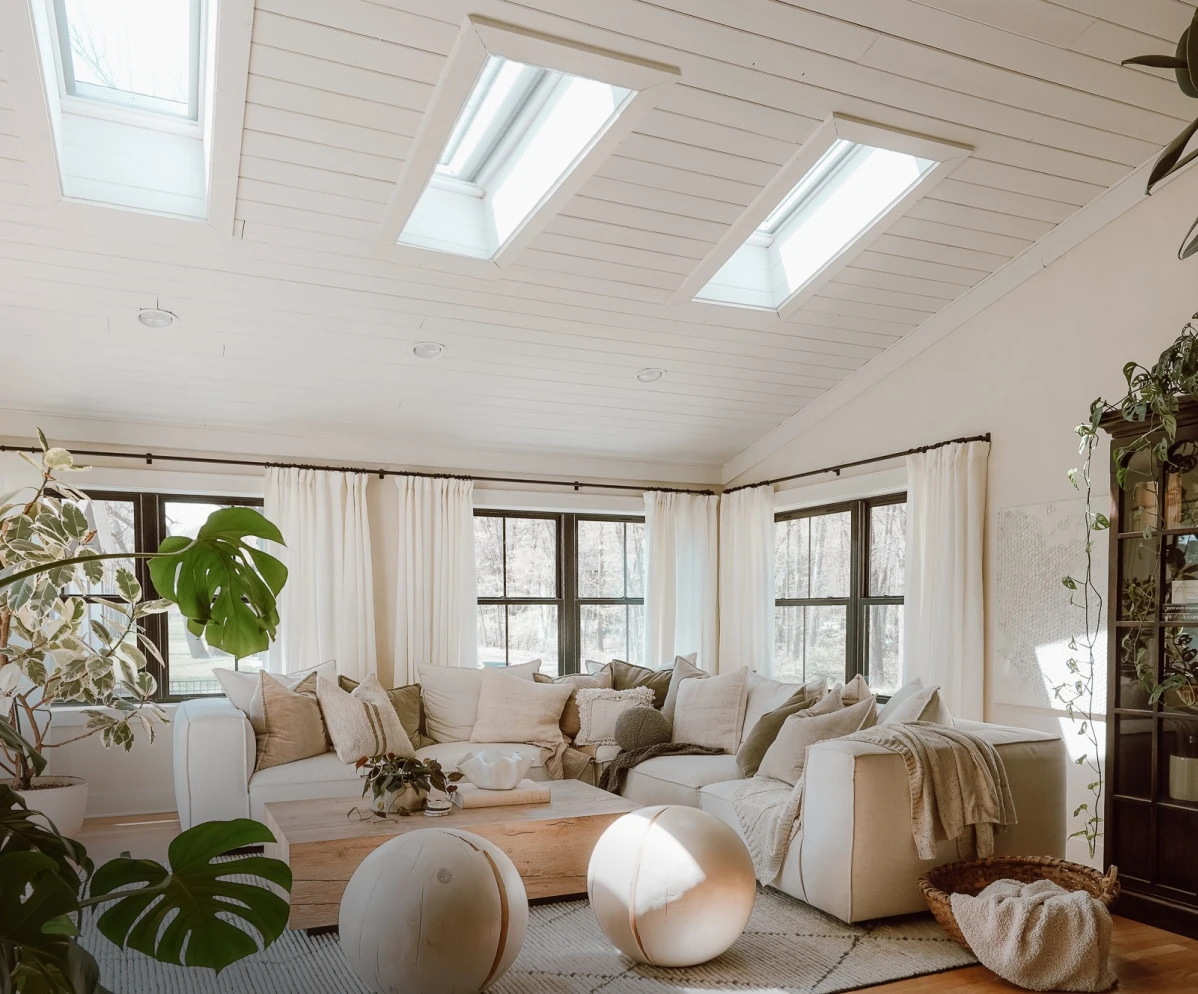 Living room interior after VELUX Skylight System installation — sunlit space with natural daylight from ceiling skylight