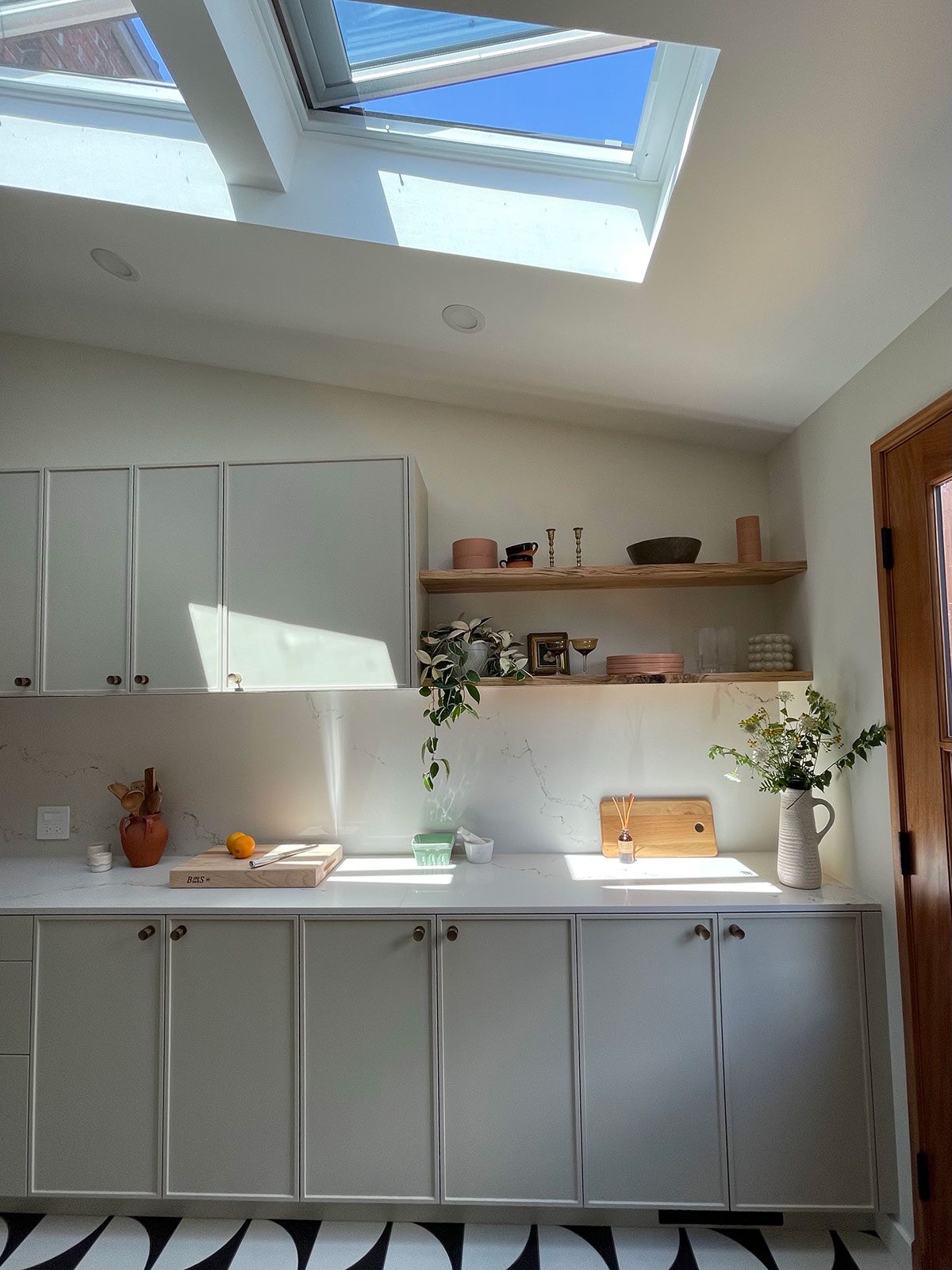 Two open venting skylight systems over the countertop space in the kitchen of the This Old House 2021.